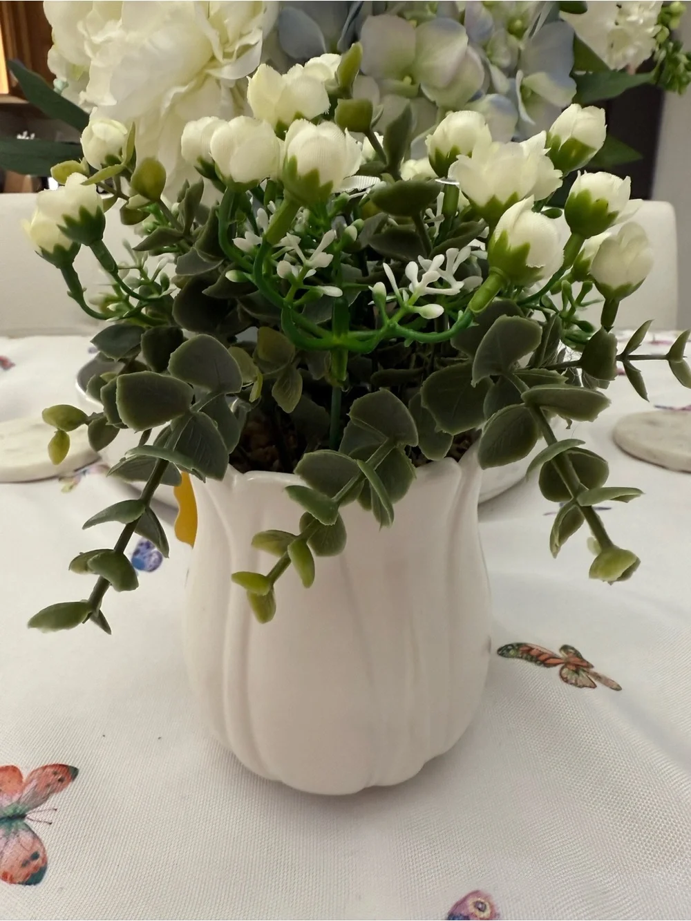 White Ceramic Vase with Green and White Faux Floral Arrangement